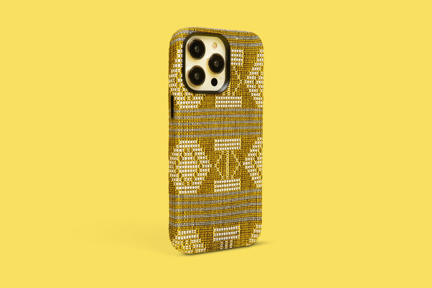 Savanna-inspired phone case with golden hues and complex patterns against a sunny yellow backdrop, a touch of African savanna for iPhone 12, 13, and 14 Pro Max, reflecting the simplicity and elegance of the vast plains.